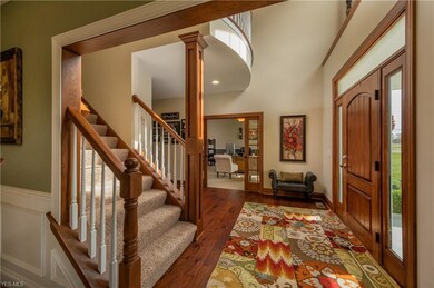 Two story foyer with hardwood floor
