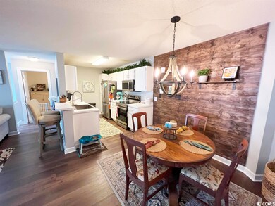 Kitchen has upgraded stainless appliances and a br