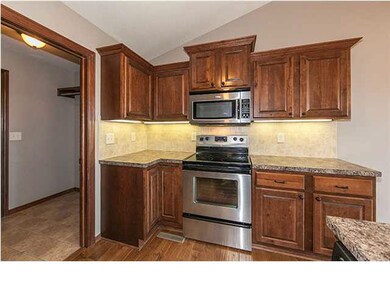 Kitchen with wood flooring & pantry