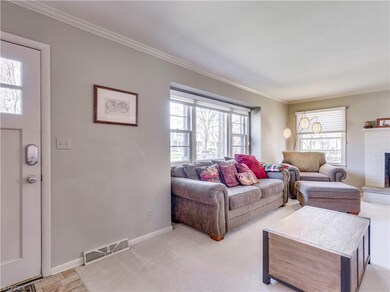 The open and airy living room.  Newer ceramic tile