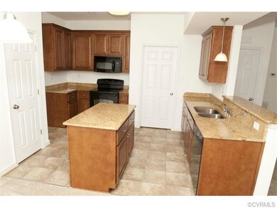 Granite countertops and maple cabinets with 