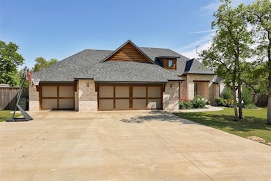 Contemporary house featuring brick siding, fence, 