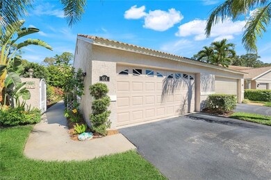 Garage featuring aphalt driveway