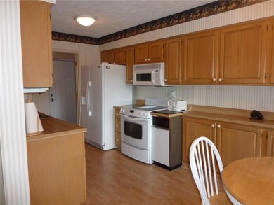 Spacious kitchen with many cabinets for storage