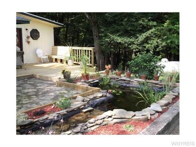 Yard/Garden. A view of the flagstone patio w/fish 