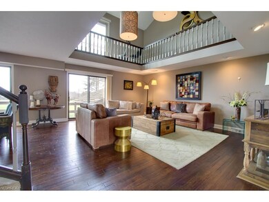 Through the foyer, enter the open great room.  Rea