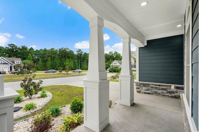View of patio featuring covered porch