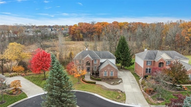 View of subject property featuring a forest