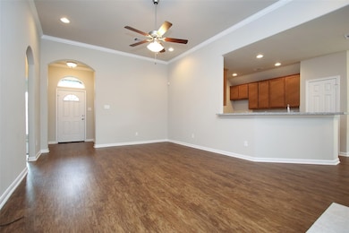 Living room opens to the kitchen