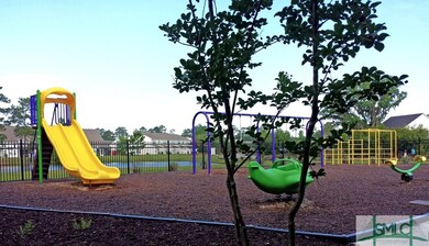 COMMUNITY PLAY GROUND WITH PARTIAL VIEW OF LAGOON