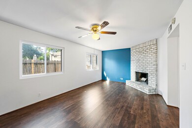 another view of the open room with wood burning fi