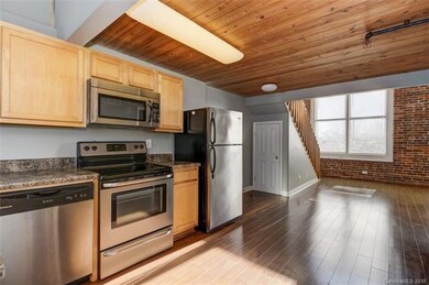 Kitchen with stainless appliances, extra under-sta