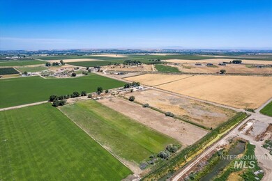 Aerial overview of property's location with rural landscape and extensive farmland