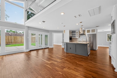 This open-concept living space features large wind