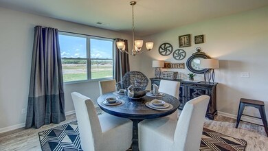 Breakfast room overlookin large windows to the backyard