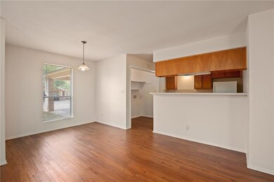 Unfurnished living room with dark wood finished f