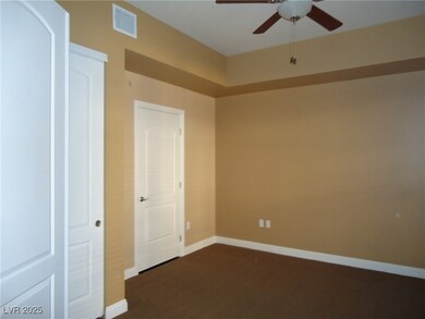 Spare room featuring visible vents, baseboards, an