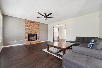 Living room with a textured ceiling, wood finished