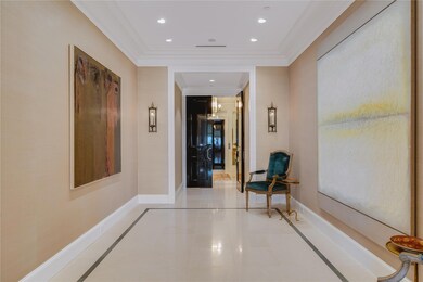 Hallway with light tile patterned floors and ornam