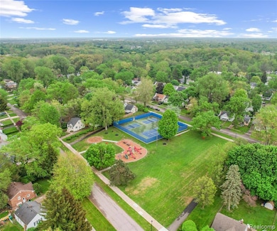 Aerial view of residential area featuring a forest