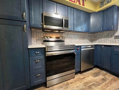 Kitchen featuring appliances with stainless steel 