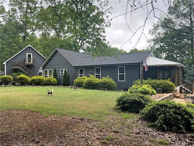 Back of property featuring a screened porch