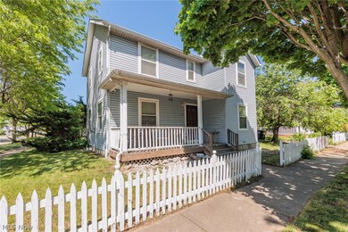 View of front property featuring a front yard and a porch