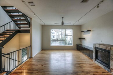 Custom built ins and a cozy fireplace area featuri