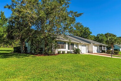 The well manicured lawn and irrigation are part of