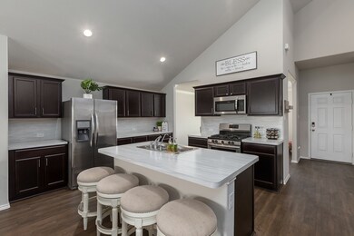 Check out this spacious kitchen with lots of cabinetry and counter space