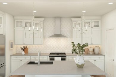Kitchen with pendant lighting and hexagonal backsplash