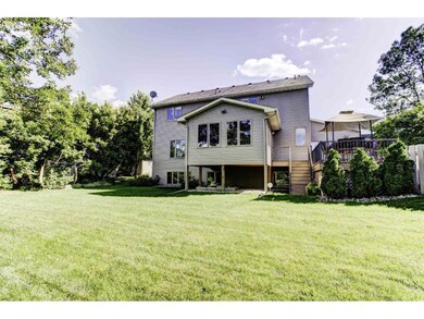 Great backyard features a paver patio fire-pit and