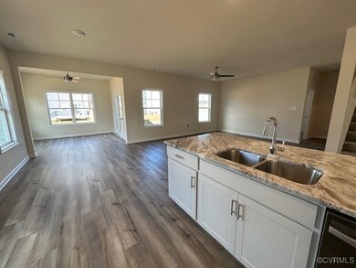View from Kitchen.  Sunroom and Family Room.