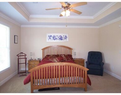 Master Bedroom. master allows for a King bed, two night stands, and there is room to spare.
