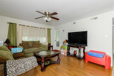 The living room has access to the back deck.