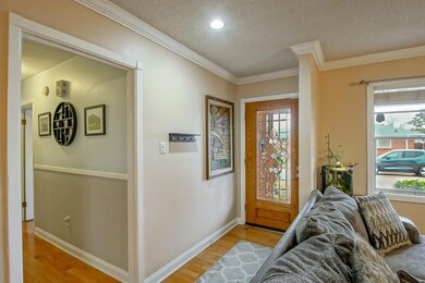 Foyer with leaded glass from door.