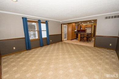 Family room view looking into kitchen.