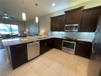 Kitchen with appliances with stainless steel finis