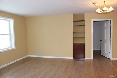 In-Law Living Room with bamboo floors. Door leads