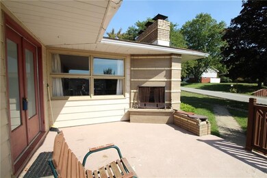 VERY cool built in outdoor fireplace on side patio