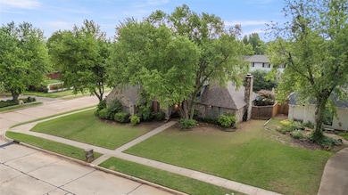 View of front of house with fence and a front yard