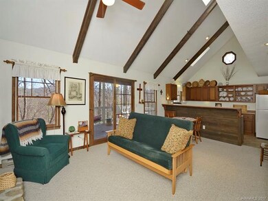 Sunny Living Room Opens to Kitchen