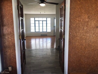 Corridor featuring dark hardwood / wood-style flooring