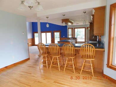 From dining room, looking into kitchen and living 