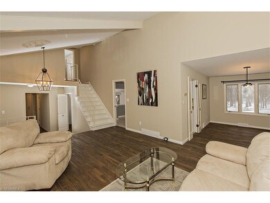 Spacious Living Room with Vaulted Beamed Ceiling a