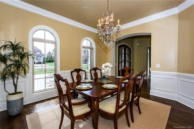 Beautiful dining room with arched windows.