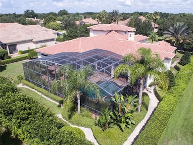 Aerial view of rear of home and pool