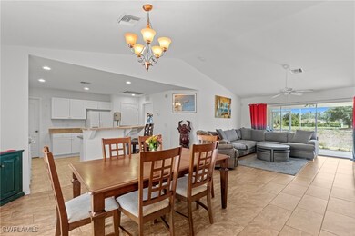 Dining room featuring recessed lighting, vaulted c