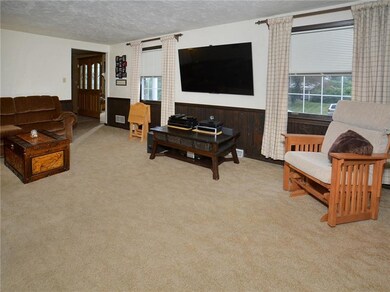 Neutral carpeting in family room.