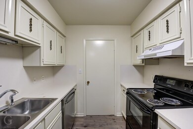 Kitchen looking to laundry area and pantry.